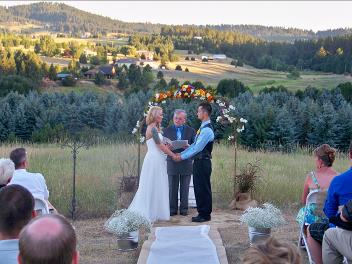 Ralph Fishburn, of Ralph's Regal Weddings, performing wedding at a private home, Greenacres, Washington.