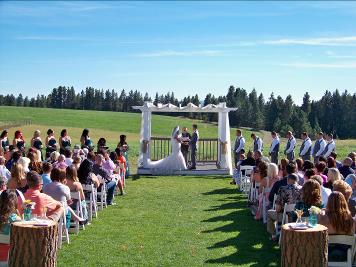 Ralph Fishburn, of Ralph's Regal Weddings, performing wedding at High Country Orchards, Colbert, Washington.